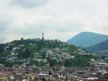 Landscape of houses and a massive statue
