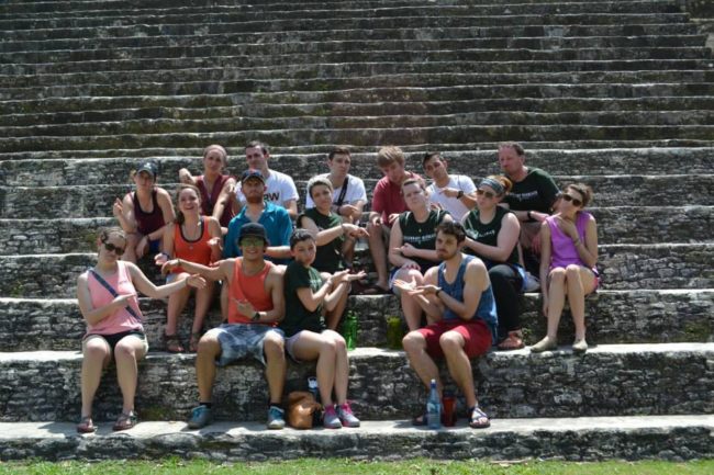 Students sitting on ancient stone steps Students sitting on ancient stone steps