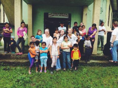 Large group of children with students