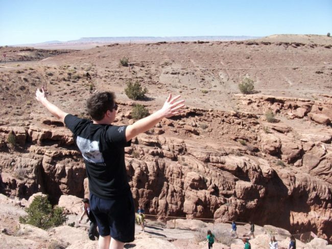 Student looking out over a massive desert Student looking out over a massive desert
