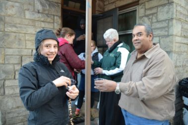 Group of volunteers outside of a house