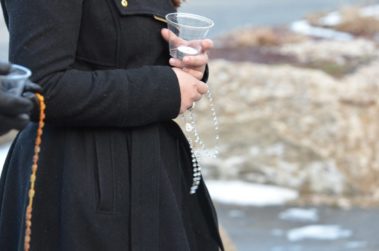 Student holding a candle