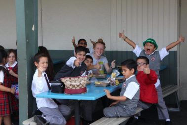 Children and Students eating lunch together