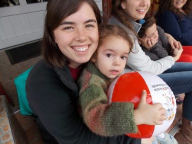 A student holding a child