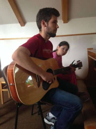 Student playing guitar